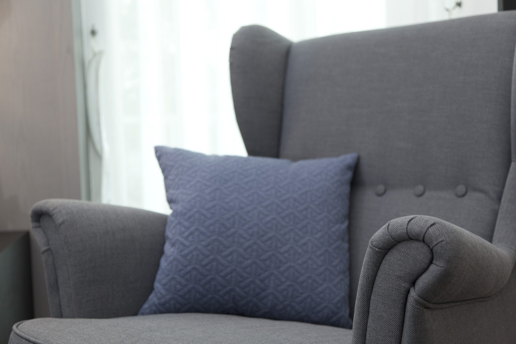 grey armchair in modern home